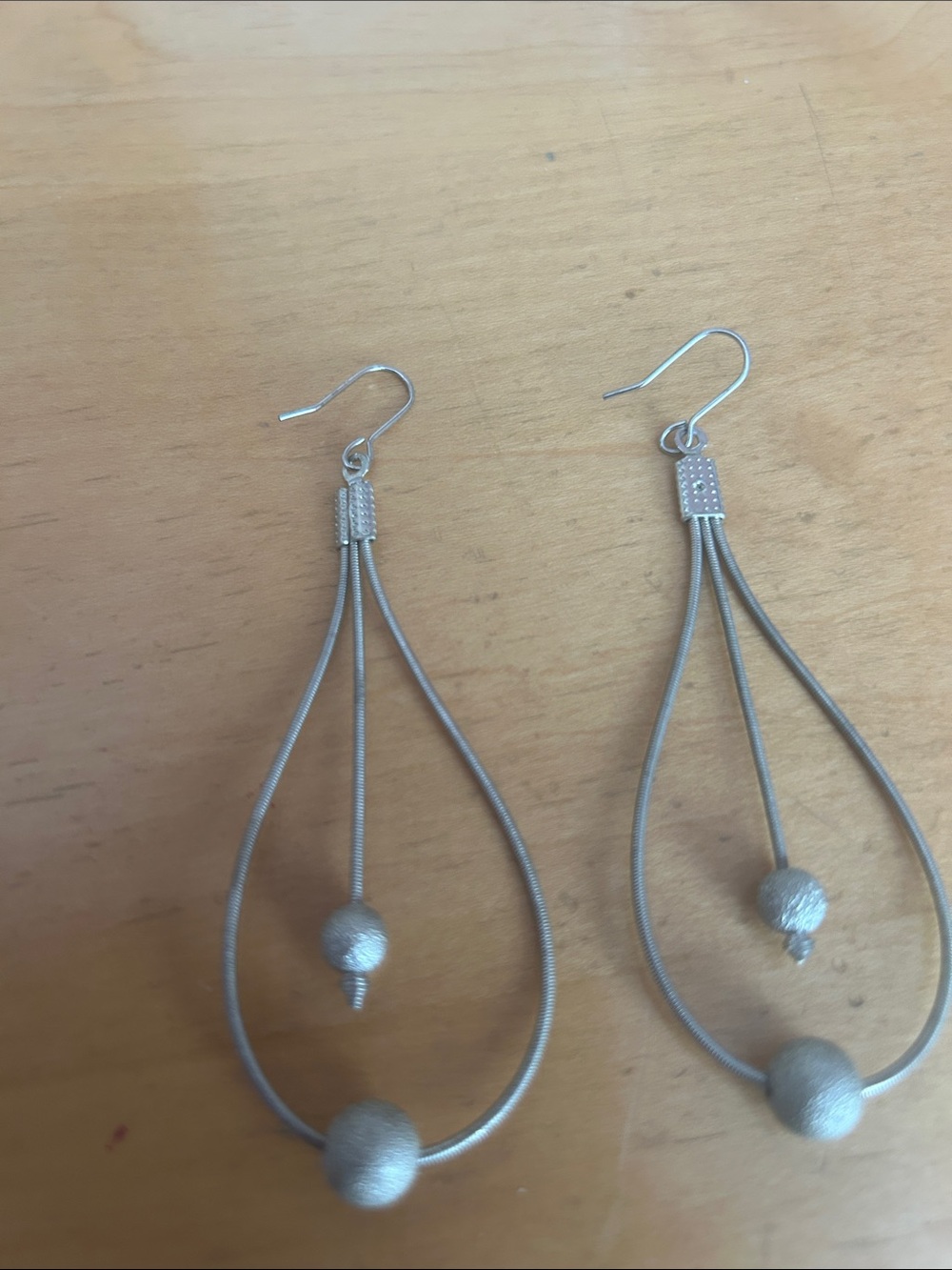 Silver Teardrop Dangle Earrings with Textured Beads